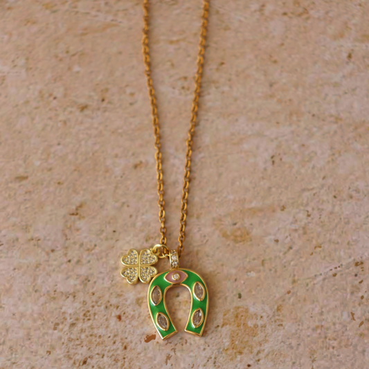 Lucky Girl Necklace — gold chain with green enamel horseshoe and clover charm
